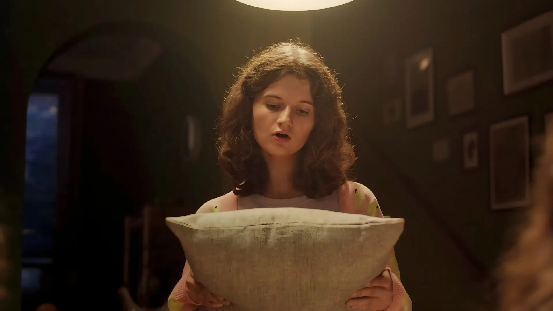 Girl sings to pillow in You're The One That I Want